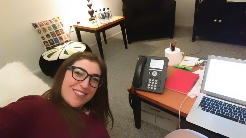 Here’s me and my favorite things: my laptop and my phone. I love a big girl office-style phone, complete with speakerphone and hold buttons. In the background, you’ll see I have a giant floor pillow in the shape of an avocado and cucumber sushi roll. You’ll also see that my pen and pencil holder is a roll of toilet paper. One day it just occurred to me and it’s worked well ever since.