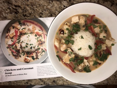 Plated coconut and chicken soup