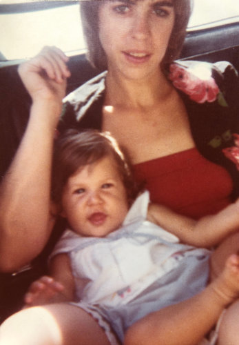 Mayim as a baby with her mom